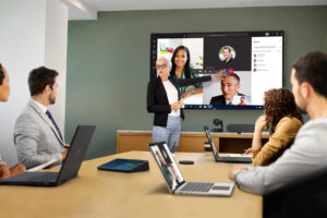 Conference room hybrid meeting with touchscreen collaboration and video conferencing setup