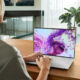 Typing on Silver CGI Dell Laptop in Bright Interior